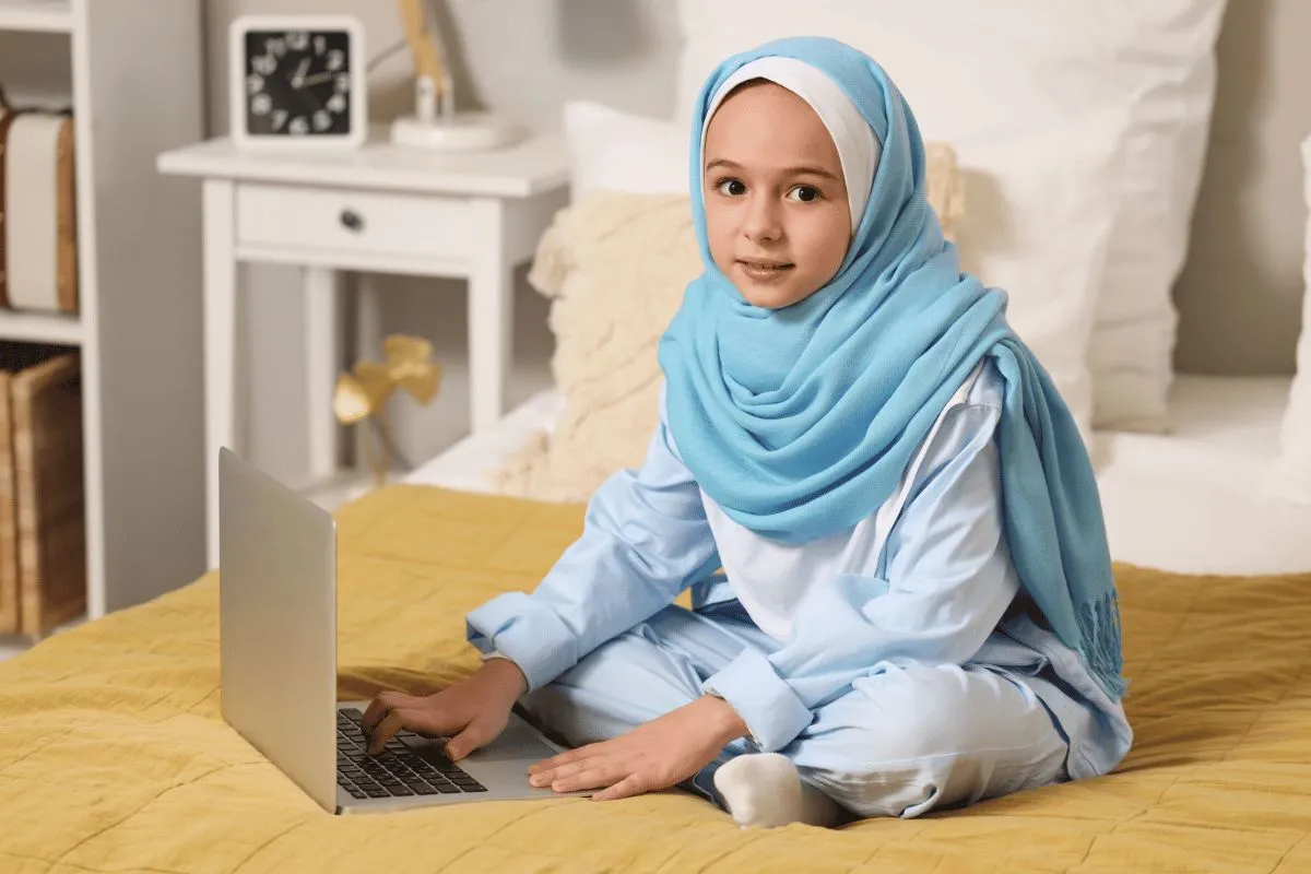 A student learning the Quran online from home with Al Hasan Online Quran Academy