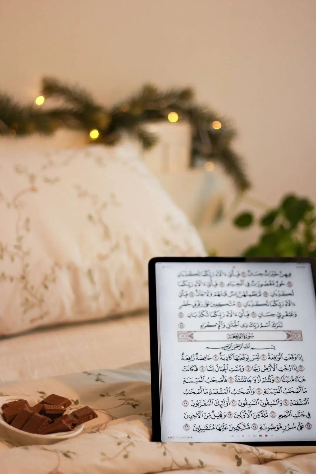 Tablet displaying Arabic Quran text during home study
