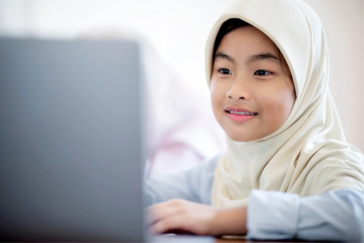 Young Muslim student taking a private Quran lesson online