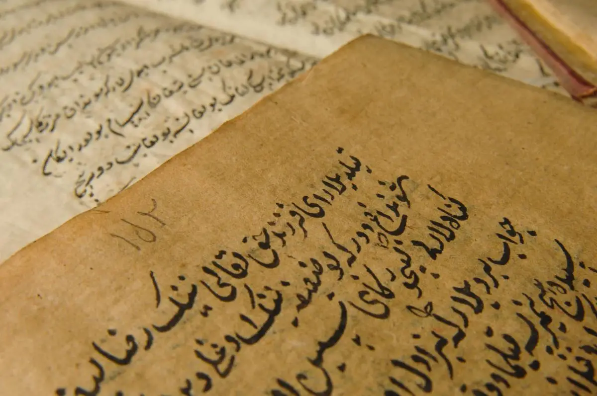 Close-up of handwritten Arabic text in an old manuscript
